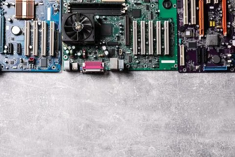 Computer motherboards on light grey table, flat lay with space for text. Elec Stock-Fotos