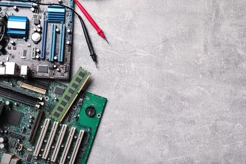 Computer motherboards on light grey table, flat lay with space for text. Elec Stock Photos