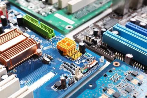 Computer motherboards on white table, closeup. Electronic device Stock Photos
