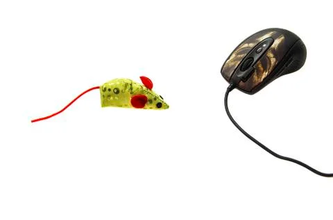 Computer mouse and bright colored toy concept Stock Photos