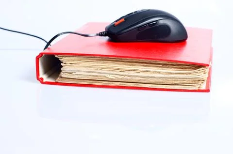 Computer mouse and file folder, concept of online education Stock Photos