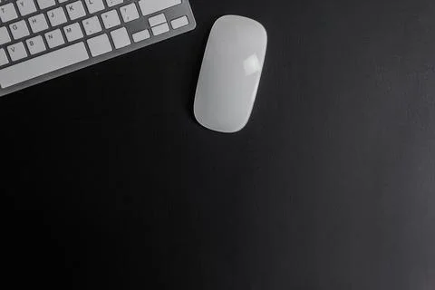 Computer mouse and keyboard on a dark background Stock Photos