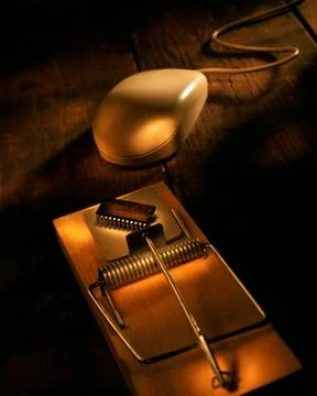 COMPUTER MOUSE AND MOUSETRAP WITH MICROCHIP AS BAIT Stock Photos