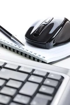 Computer mouse and notebook with pen Stock Photos
