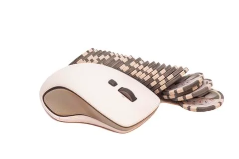 Computer mouse and pile of gambling chips. Online internet casino 写真素材