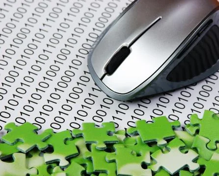 Computer mouse and  puzzles on a binary code 写真素材