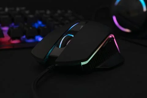Computer mouse and RGB keyboard on black background, closeup Foto stock