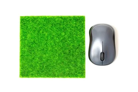 Computer Mouse and a Vibrant Grass Mousepad 写真素材