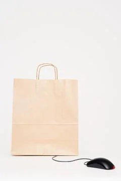 Computer mouse attached to a paper bag Stock Photos