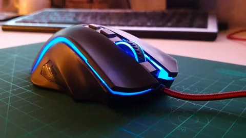 Computer mouse with backlight. Close-up of gaming electronics. Video stock 154968643