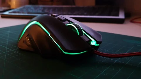 Computer mouse with backlight. Close-up of gaming electronics. Video stock 154968695