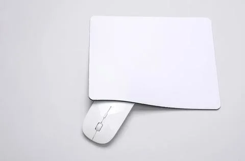 Computer mouse with blank paper on light grey background Stock Photos