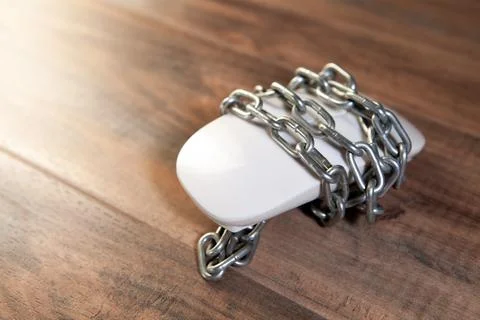 Computer mouse with chain and padlock on wooden background. Internet securi.. Stock Photos