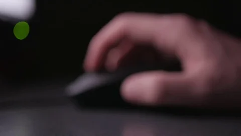 Computer mouse clicking and using at night Stock Footage 84572566