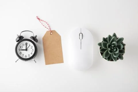 Computer mouse, clock and sale tag on white desk, online sale, cyber monday,  Stock Photos