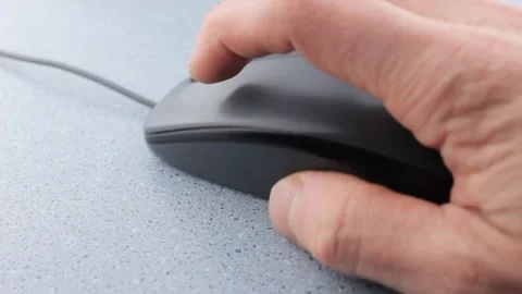 Computer mouse close-up.Computer user uses mouse.Clicking gray computer mouse. Stock Footage 195706447