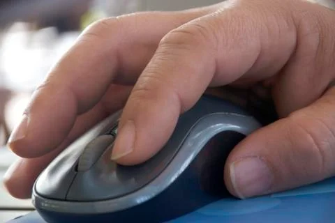 Computer mouse close-up male hand Stock Photos