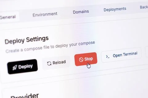 A computer mouse cursor hovering over a red stop button in a web dashboard Stock Photos