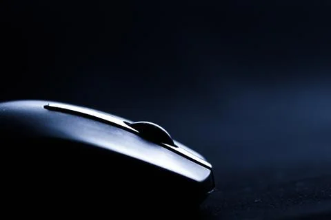 Computer mouse on a dark background closeup Stock Photos