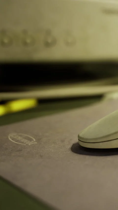 Computer mouse on desk near printer with papers scattered around Stock Footage 334183815