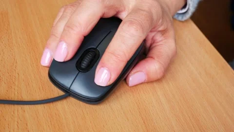 Computer mouse in a female hand Stock Footage 166375680