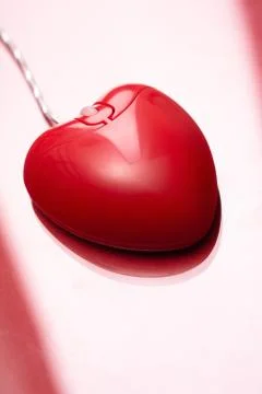 Computer mouse in form of heart in isolation Stock Photos