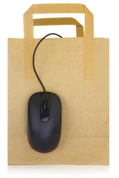 Computer mouse hanging on a shopping bag Stock Photos