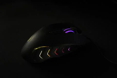 Computer mouse with LED backlight on a dark background Stock Photos