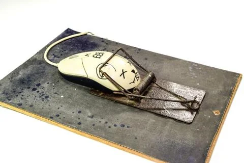Computer mouse is a man in a mousetrap. Humorous collage in the sphere of i t Stock Photos