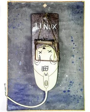 Computer mouse is a man in a mousetrap. Humorous collage in the sphere of i t Stock Photos