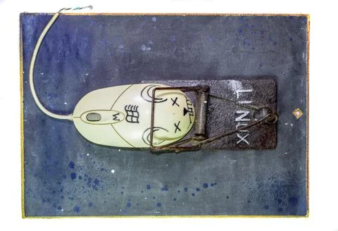 Computer mouse is a man in a mousetrap. Humorous collage in the sphere of i t Foto stock