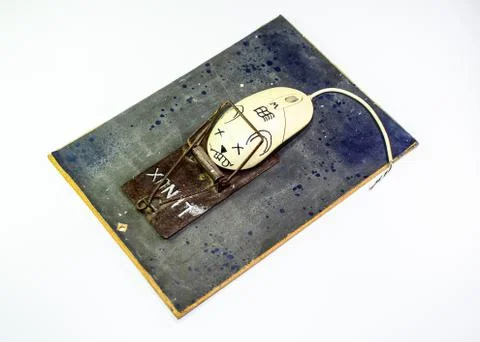 Computer mouse is a man in a mousetrap. Humorous collage in the sphere of i t Stock Photos
