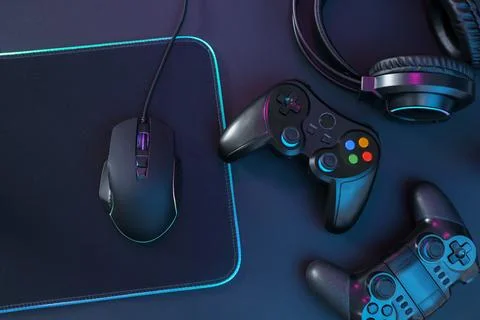 Computer mouse, mousepad, headset and game controllers on black background,.. Stock Photos