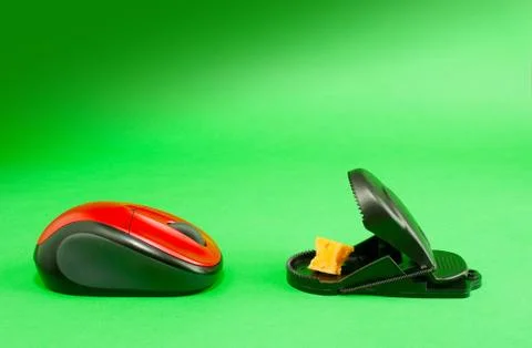 Computer mouse with a mousetrap Stock Photos