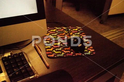 Computer mouse pad with colorful dachshund dogs Stock Photos