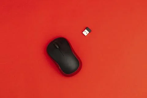 Computer mouse on red background Stock Photos