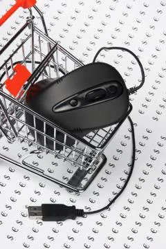 Computer mouse  in  shopping trolley Stock Photos