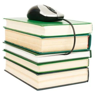 Computer mouse on stack of books Foto stock