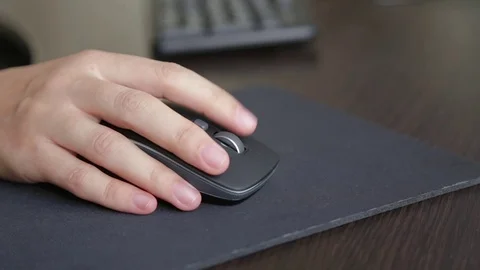 Computer mouse in a woman's hand Stock Footage 82271923