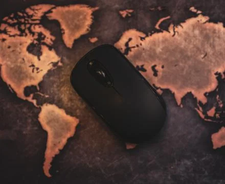 Computer Mouse on World Map Globe Mousepad Stock Photos