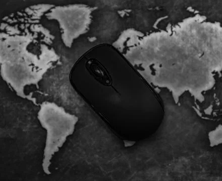 Computer Mouse on World Map Globe Mousepad Stock Photos