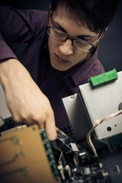 Computer Nerd Upgrading His Hardware Stock Photos