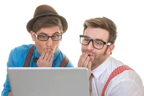 Computer nerds looking at laptop Stock Photos