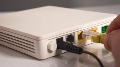 Computer network cable inserts in lAN router port Stock Photos