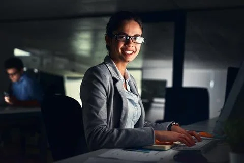 Computer, night and portrait of designer woman in web development office for Stockfoto's