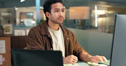 Computer, night and typing with designer man at desk in office for project Stock Footage 322569649