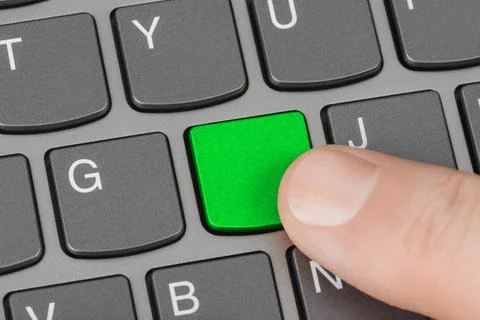 Computer notebook keyboard with blank green key Computer notebook keyboard... Stock Photos