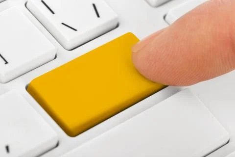 Computer notebook keyboard with blank yellow key Stock Photos