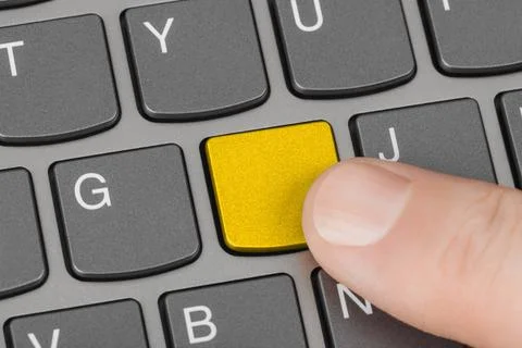 Computer notebook keyboard with blank yellow key Computer notebook keyboar... Stock Photos
