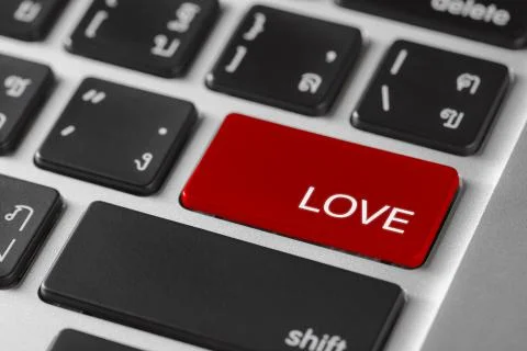 Computer notebook keyboard selected focus on  red enter button with word Love Stock Illustration